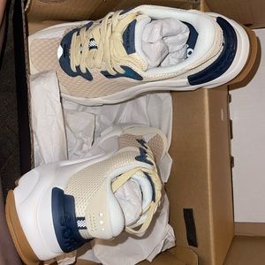 New Sorel shoes never used with tags. White creme tan color, size 8 in women’s